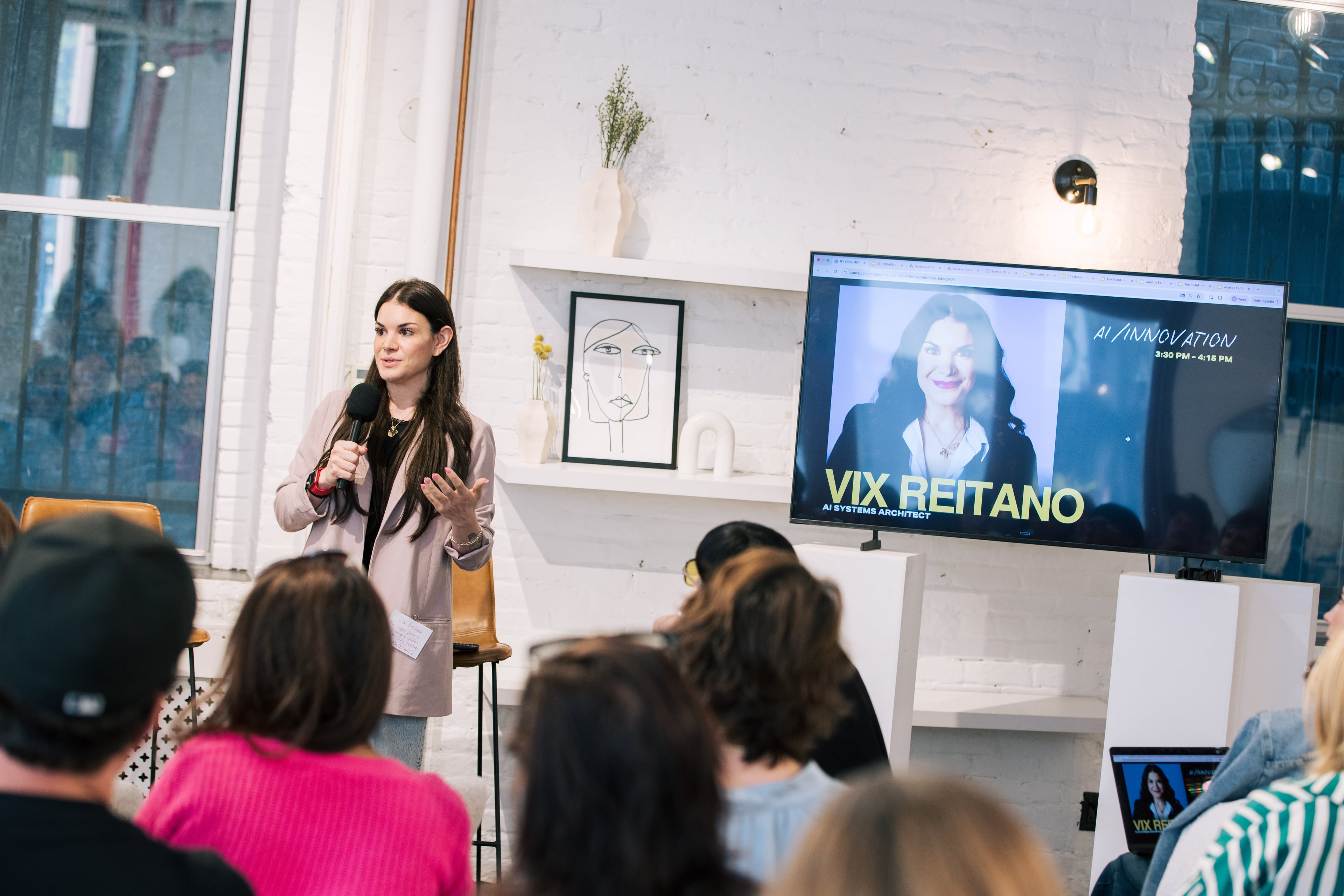 Vix Reitano speaking on stage